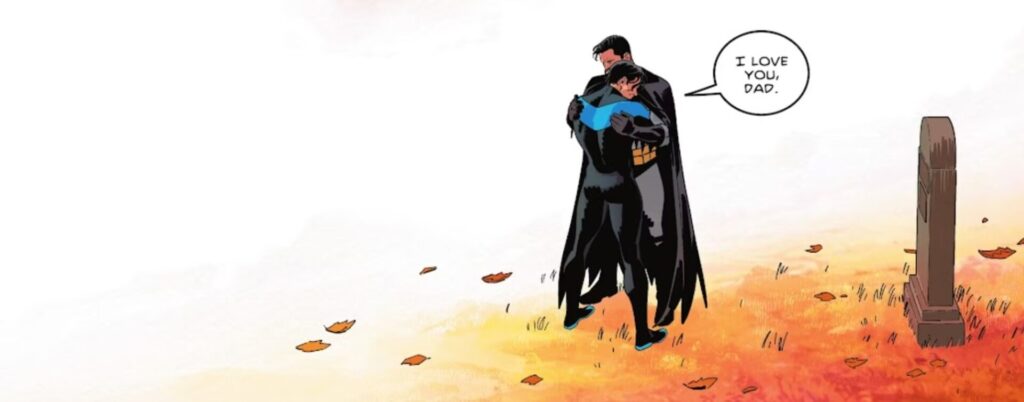 Asa Noturna e Bruce Wayne se abraçam.